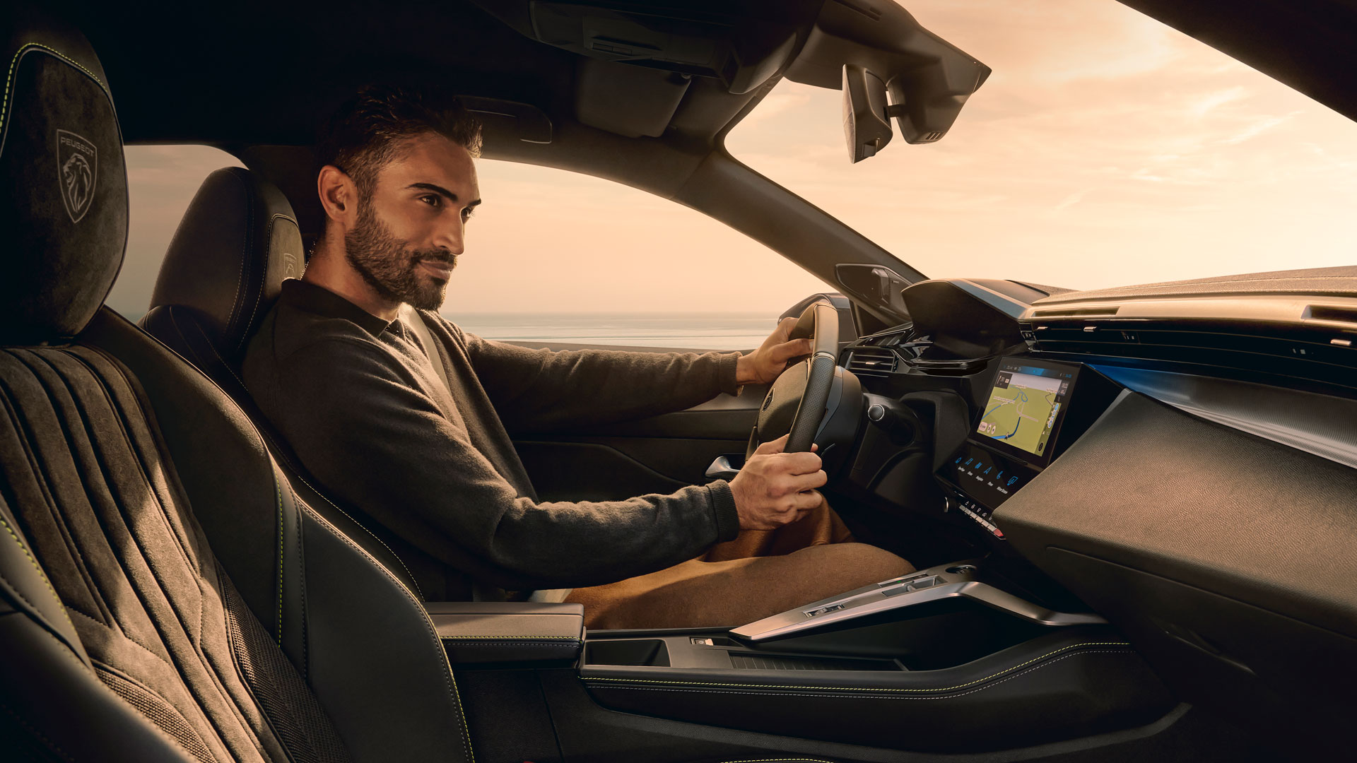 Man driving a Peugeot